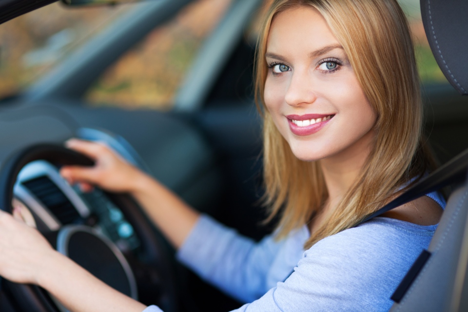 Woman smiling in vehicle